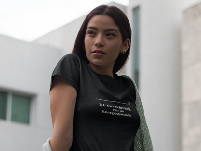 Woman wearing a black t-shirt with text in an urban setting